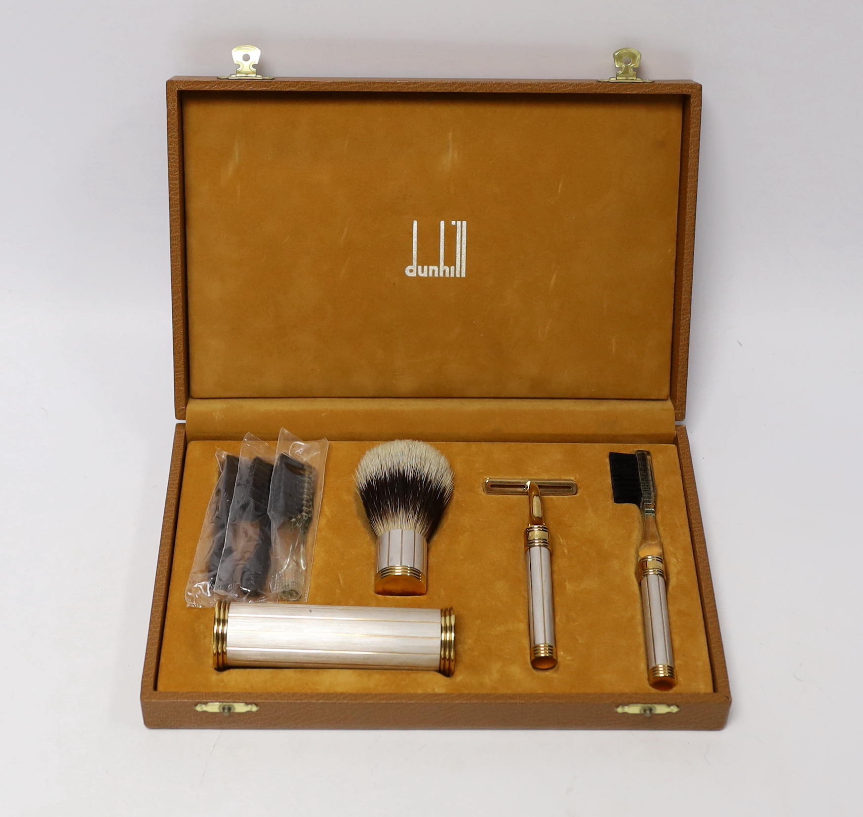 A cased gentleman’s Dunhill vanity set including shaving brush, razor and toothbrush